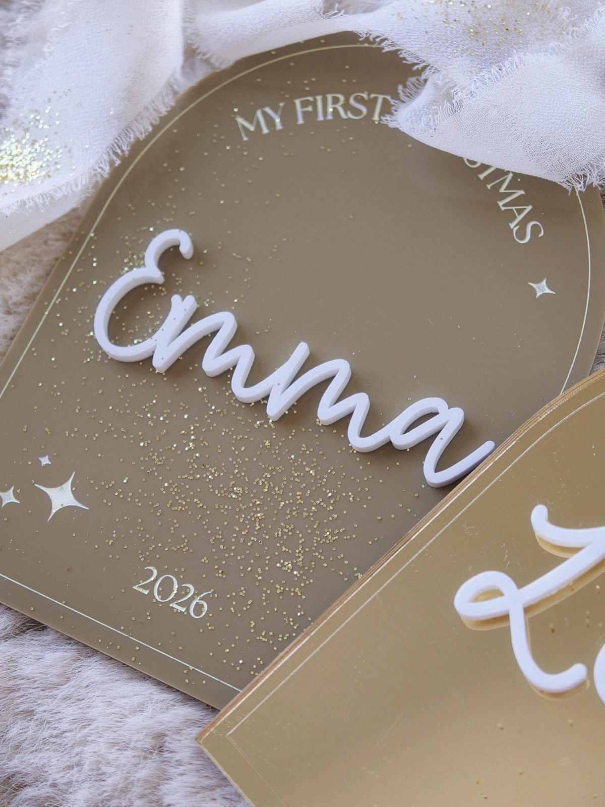 First Christmas Arch – close-up of the name in white acrylic