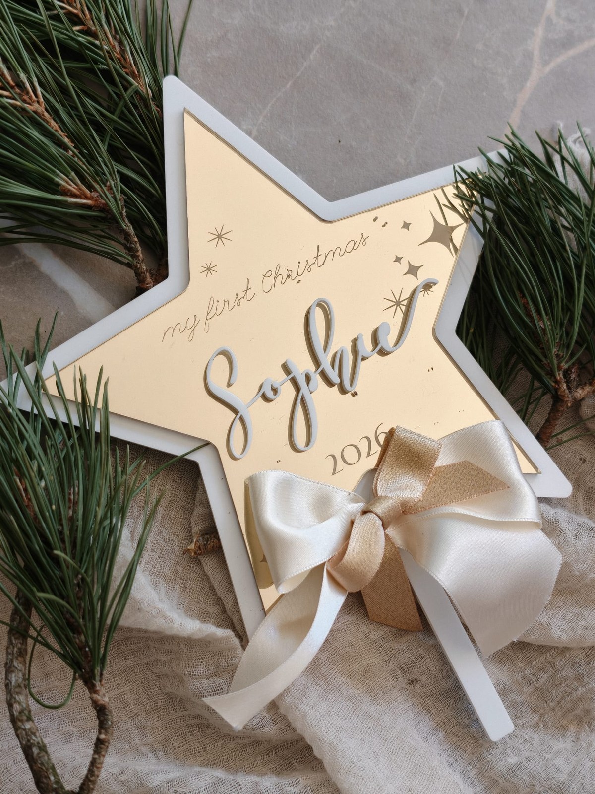 First Christmas Star – personalised mirror-gold star with name